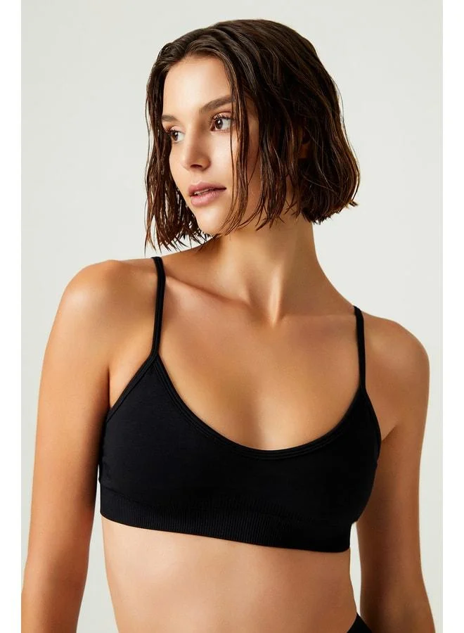 Los Ojos x Melodi Black Seamless Support Strapped Sports Bra Adjustable.