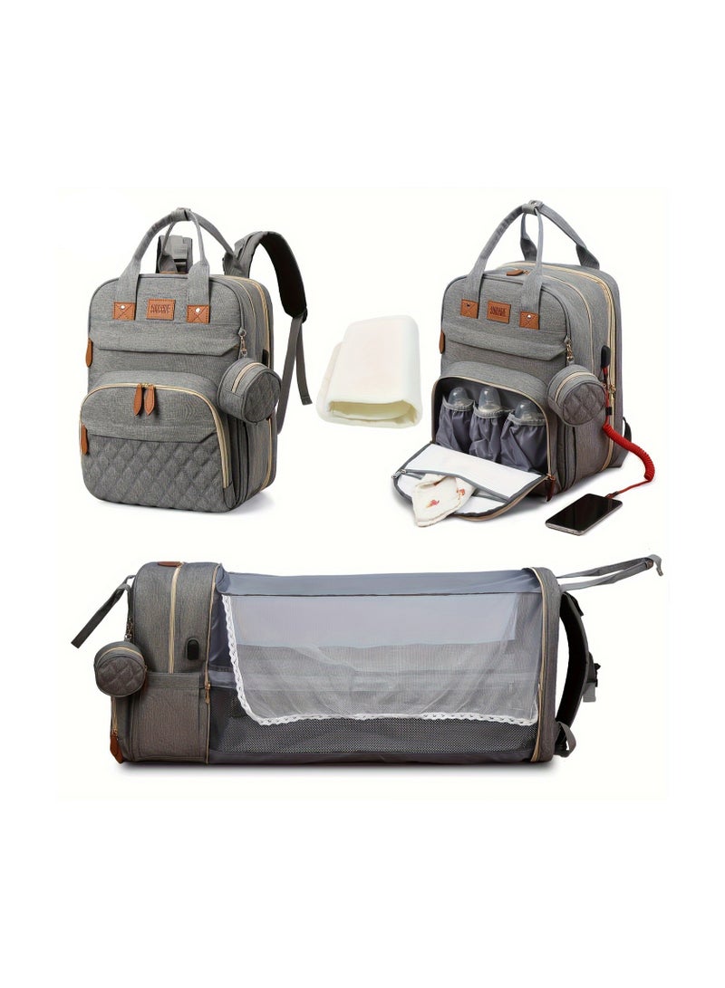 حقيبة ظهر حفاضات مع وسادة تغيير – حقيبة سفر متعددة الوظائف للآباء والأمهات مع منفذ شحن USB، قماش بوليستر مقاوم للشمس، إغلاق بسحاب، جيوب عملية، وحزام يدوي قوي – مثالية للرحلات واستخدام ما قبل المدرسة - رمادي - Image 1