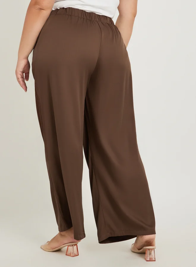 Styli Styli Plus Size Solid Pleated Wide Leg Pants with Button Detail