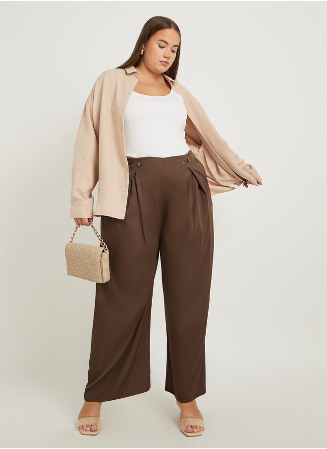 Styli Styli Plus Size Solid Pleated Wide Leg Pants with Button Detail  - Image 1