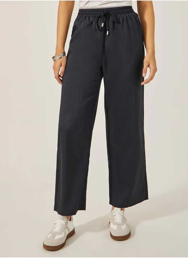 ستايلي Textured Mid Rise Wide Leg Pants with Drawstring
