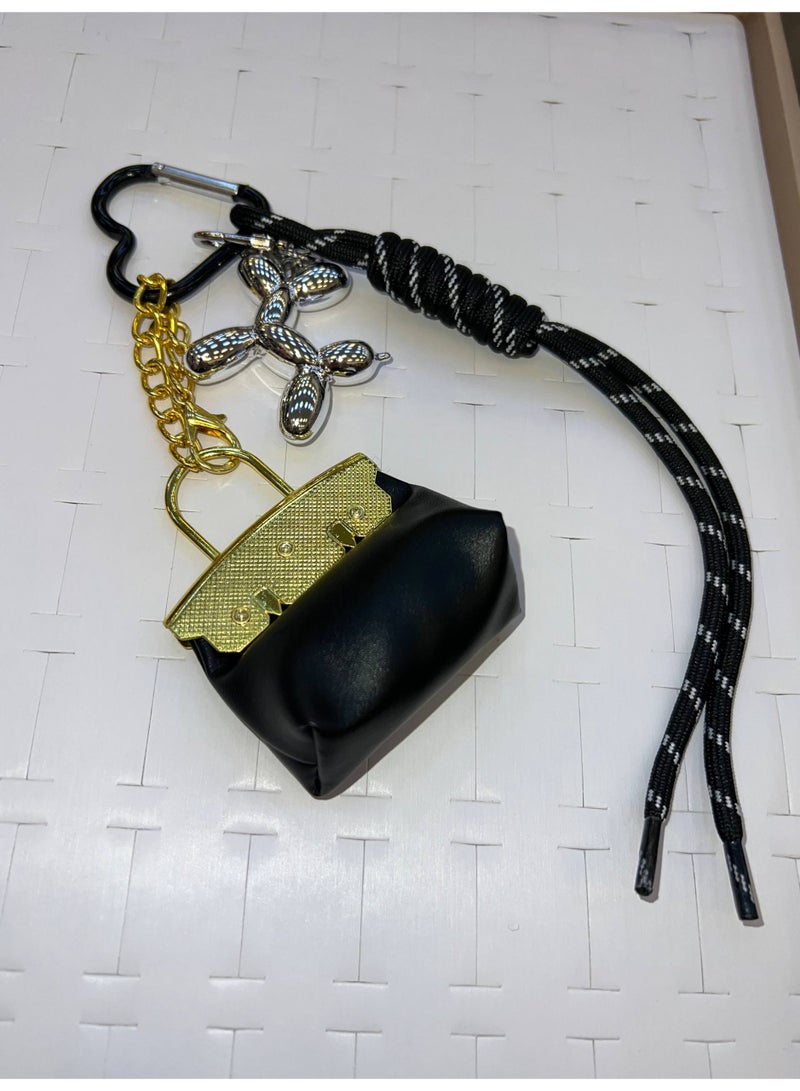 A stylish heart-shaped bag and keychains in assorted colors - Image 2