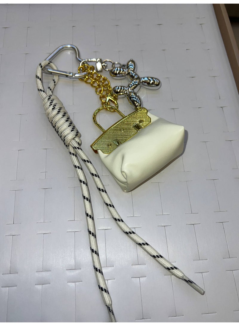 A stylish heart-shaped bag and keychains in assorted colors - Image 3