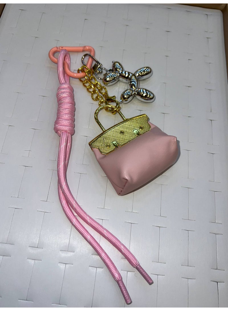 A stylish heart-shaped bag and keychains in assorted colors - Image 4