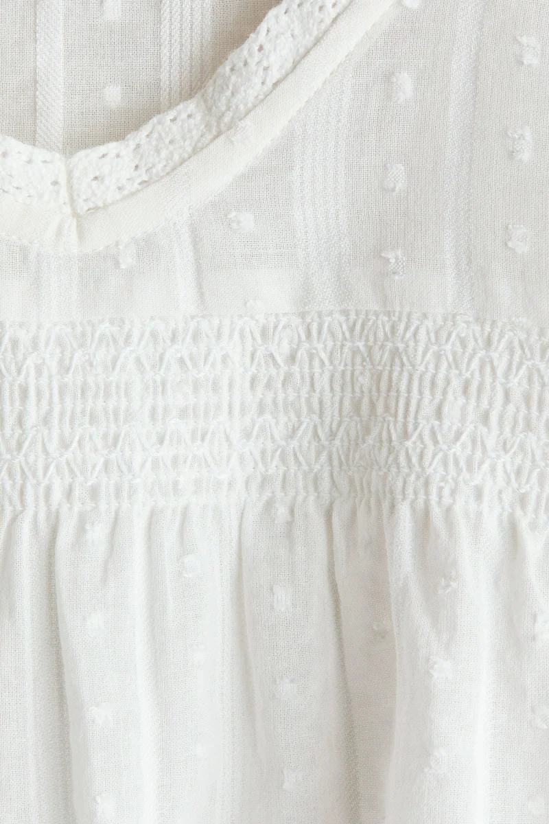 اتش اند ام بلوزة بأكمام مكشكشة