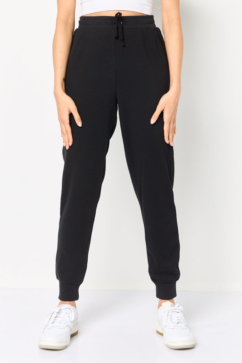 Nike سروال اليوغا الرياضي للنساء، أسود - Image 1