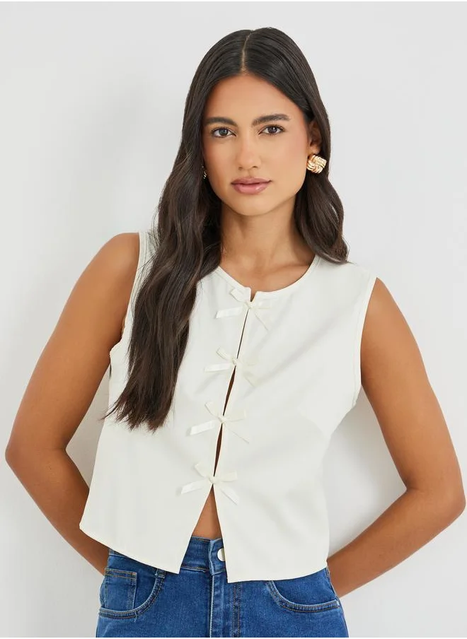 Styli Styli Bow Tie Front Slit Sleeveless Top