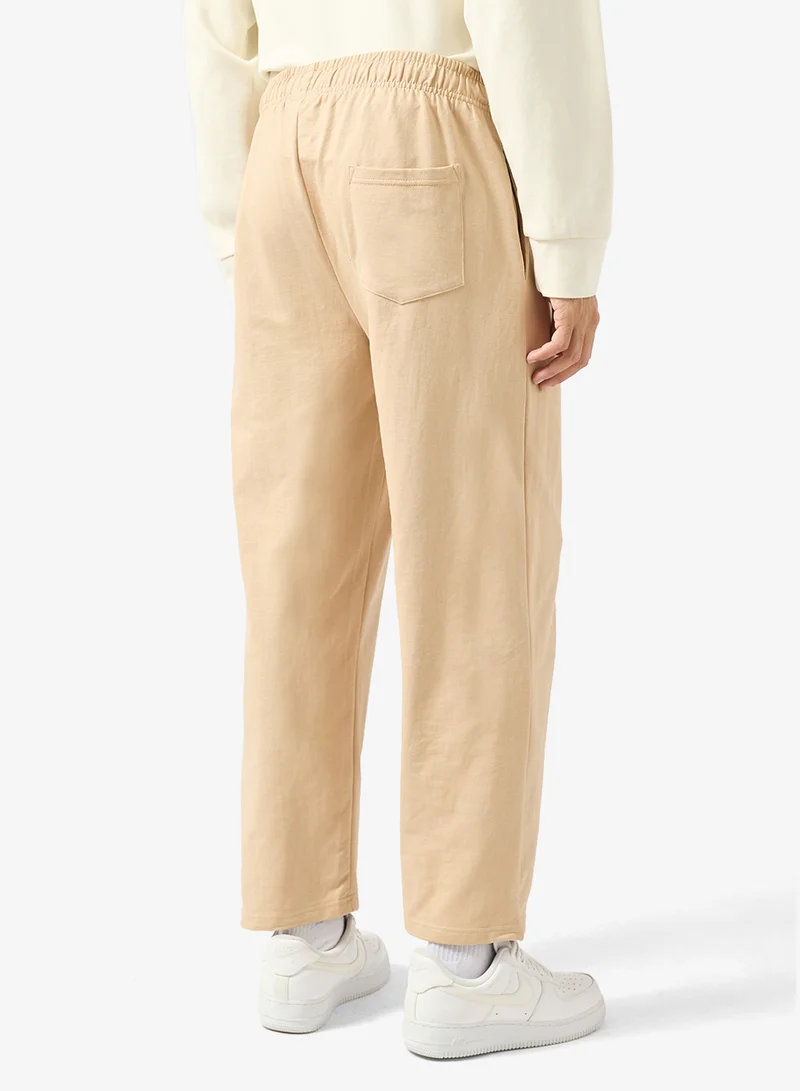 Seventy Five Beige Text Print Relaxed Fit Joggers for Men | Best Price UAE