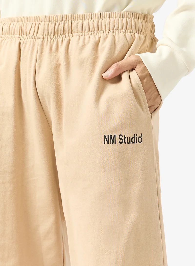 Seventy Five Beige Text Print Relaxed Fit Joggers for Men | Best Price UAE