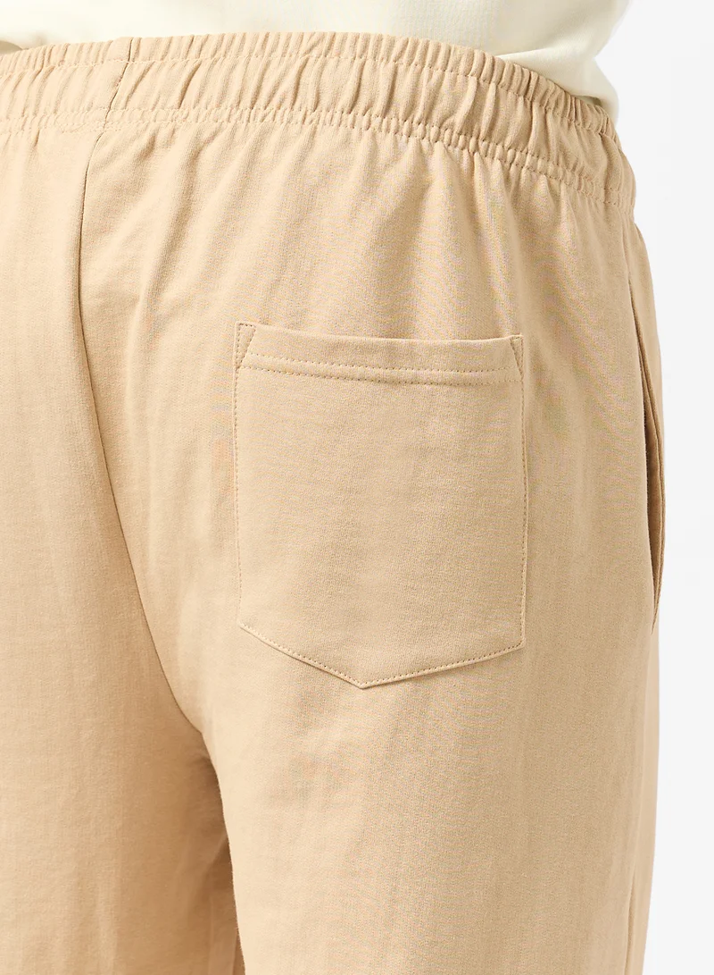 Seventy Five Beige Text Print Relaxed Fit Joggers for Men | Best Price UAE