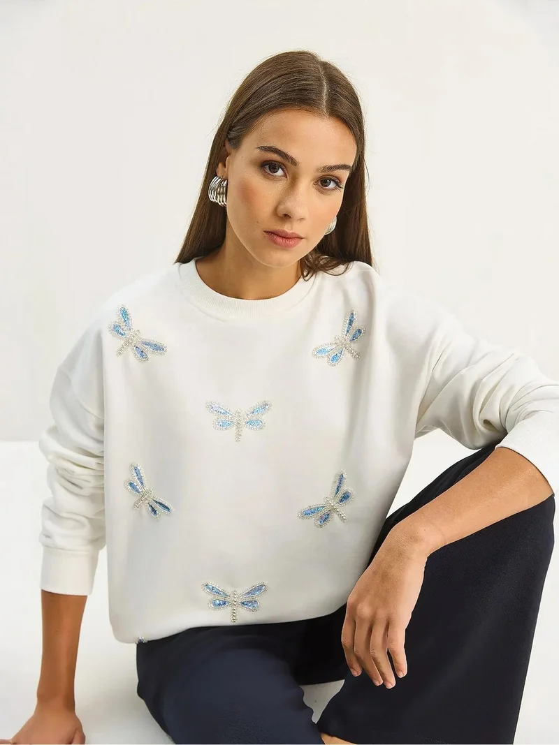 بيانكو لوتشي سويت شيرت مطرز بفراشة لوتشي