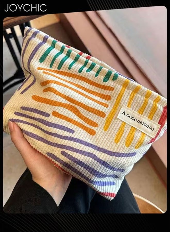 Joychic حقيبة مكياج نسائية من قماش الكوردuroy بخطوط ملونة، حقيبة تجميل محمولة للسفر للنساء والفتيات، حقيبة مكياج بسعة كبيرة، حقيبة للعناية بالبشرة ومنظم - Image 1