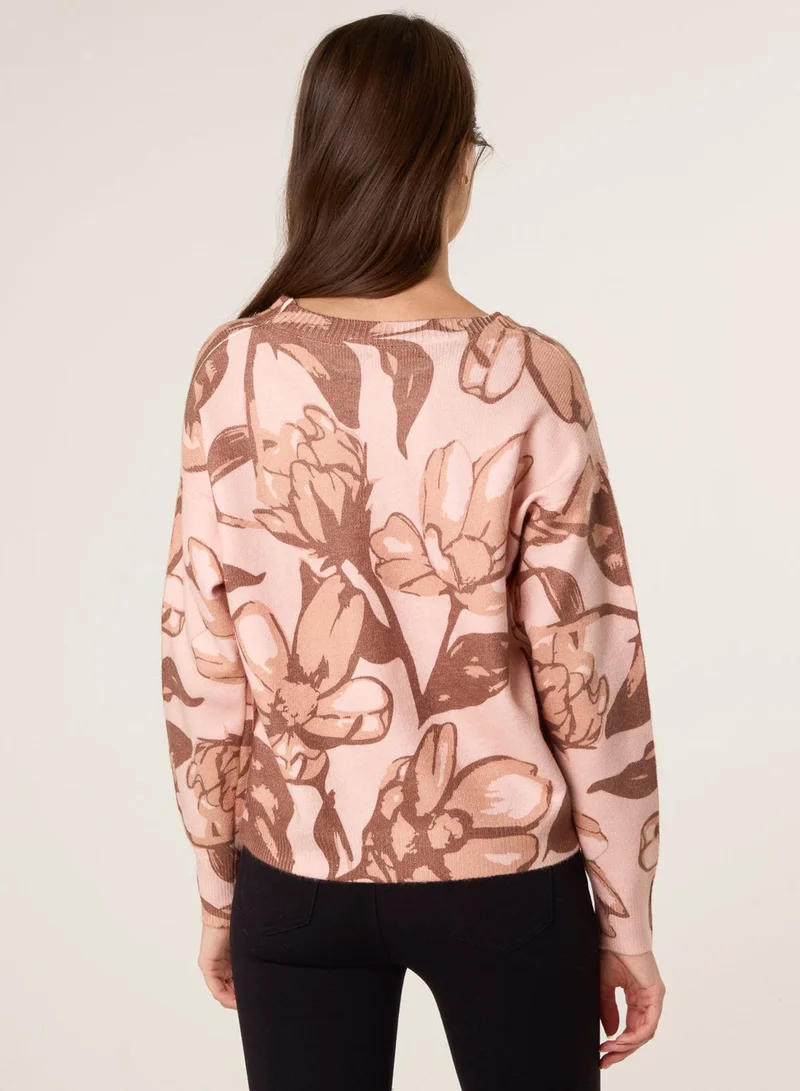 بلو فانيلا كنزة مزينة بترتر على شكل زهرة