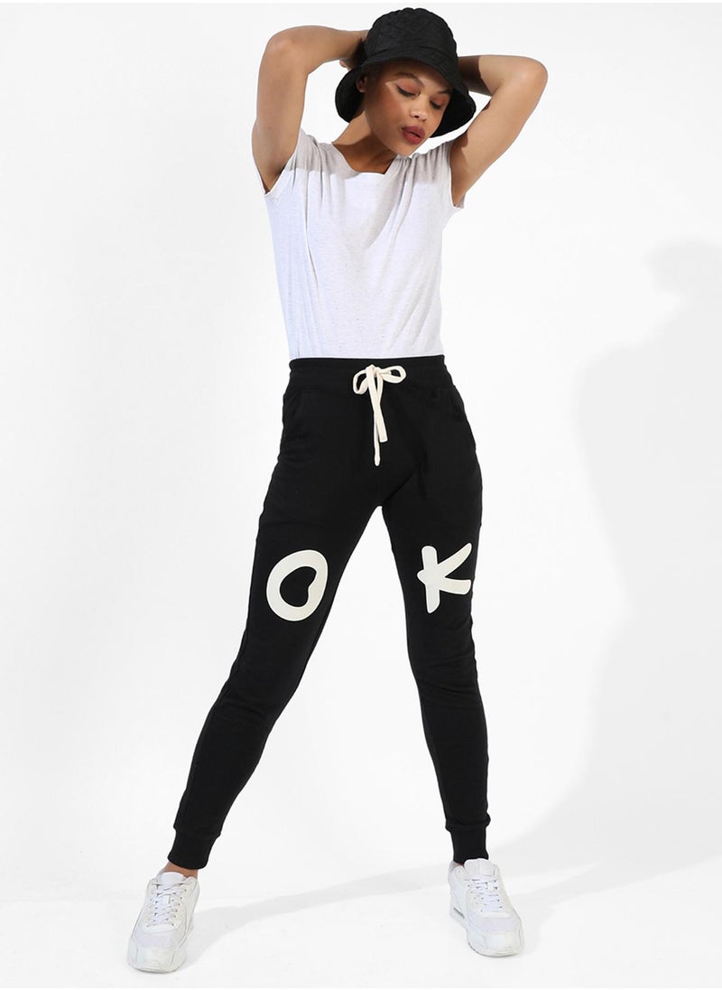 Campus Sutra Campus Sutra Women's Black Printed Regular Fit Trackpants | Slanted Open Pockets | Drawstring Waist | Trackpants Crafted With Comfort Fit & High Performance For Everyday Wear  - Image 5