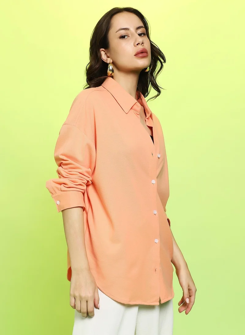 كامبوس سوترا Women's Cantalope Orange Solid Oversized Shirt For Casual Wear | Spread Collar | Long Cuffed Sleeves | Button Closure | Oversized Shirt Crafted With Comfort Fit For Everyday Wear