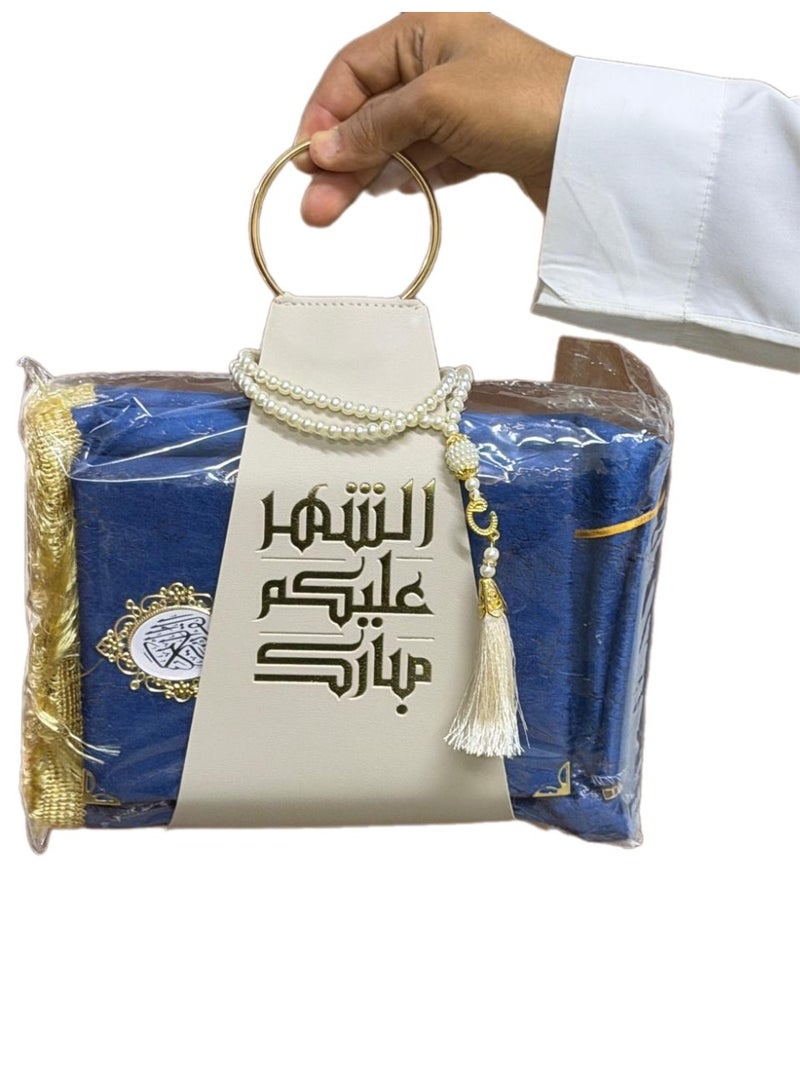 A prayer rug, a Quran, and prayer beads, presented with a suitable strap, as a Ramadan gift. - Image 1