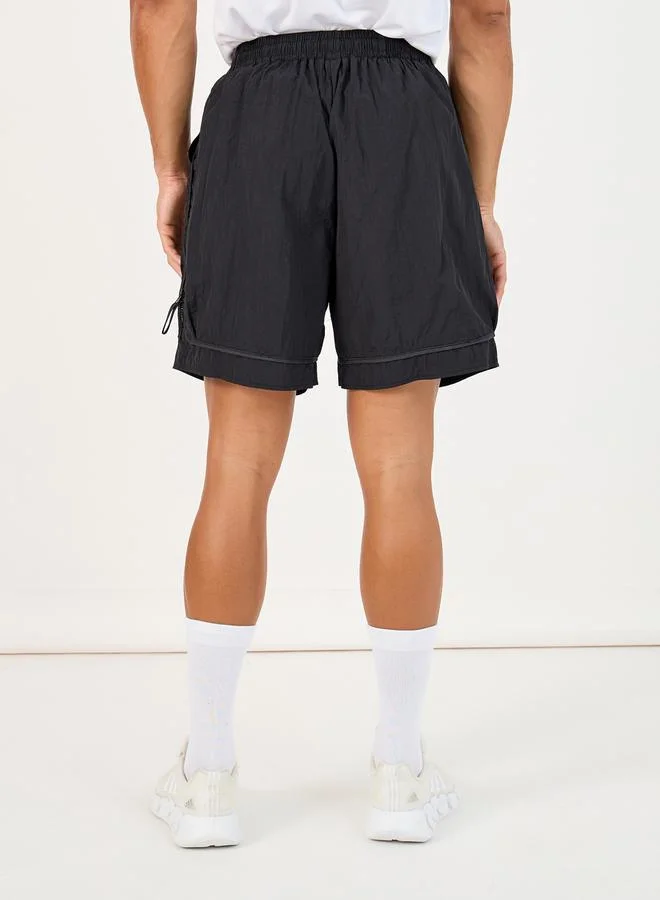 ستايلي 7inch Quick Dry Woven Shorts with Tape Hem & Zip Detail