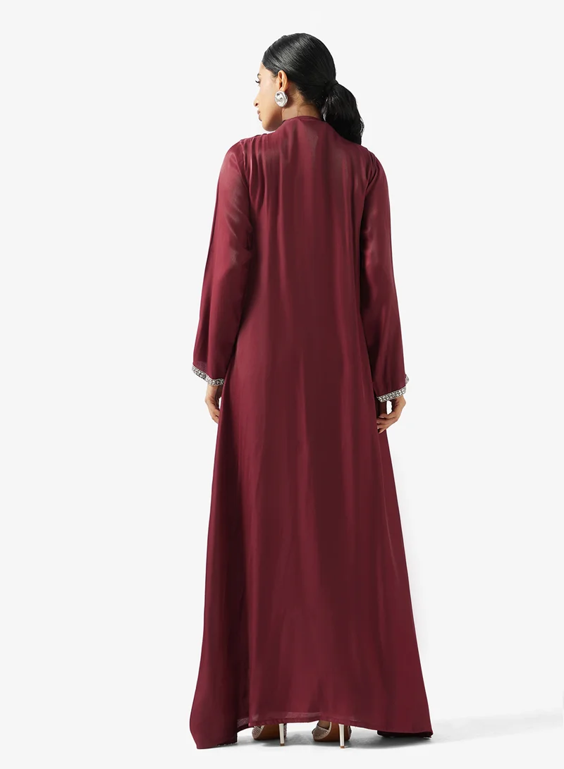 جولدن ابل عباية بياقة على شكل حرف  مع ترتر