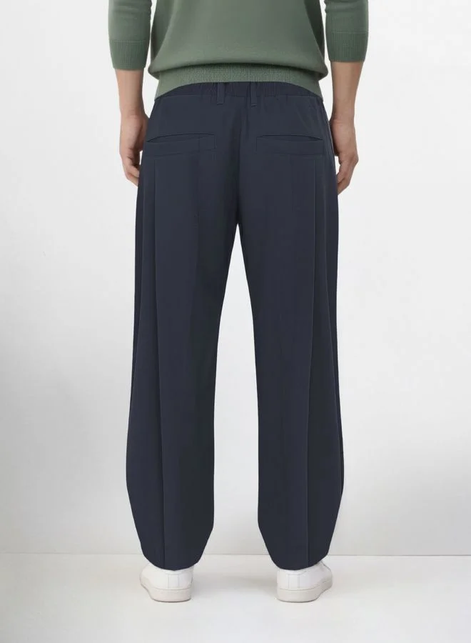 شركة المرآب الهندية Men Loose Fit Solid Cross Pocket Mid-Rise Trousers