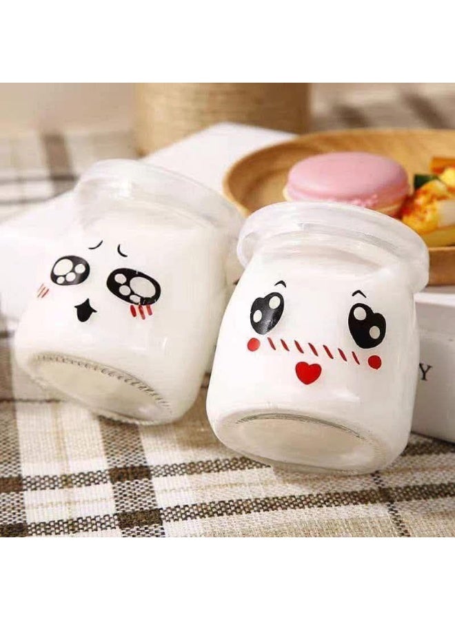 Add fun and organization to your kitchen with this 10-piece imported Emotion Glass Jar Set (100ml each) featuring cute emoji designs. Equipped with airtight plastic lids, these versatile jars are perfect for baby meals, yogurt, pudding, or jams, ensuring safe, leak-proof travel, and are fully microwave and dishwasher safe. - Image 1