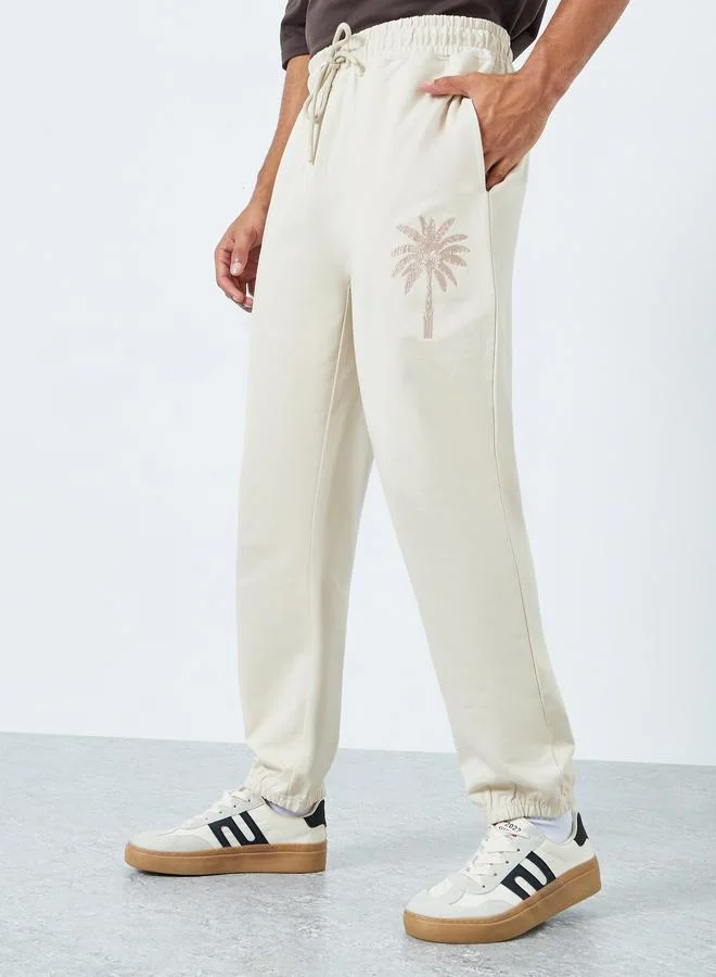 Men Khaki Embroidered Palm Tree Joggers
