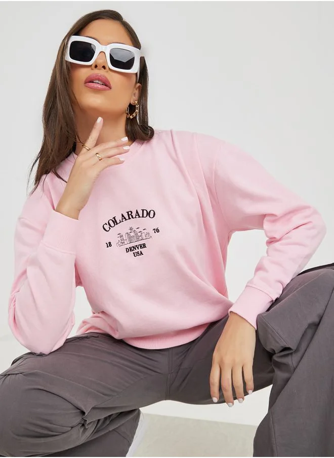 ستايلي Regular Fit Longline Embroidered Slogan Sweatshirt