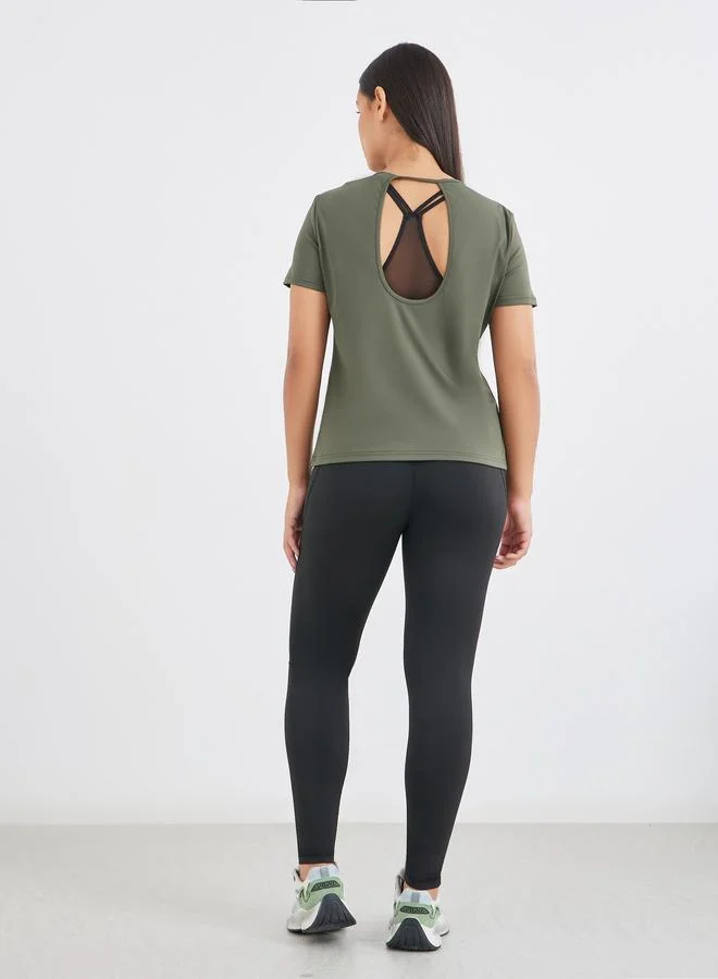 Styli Styli Twist Knot Open Back Short Sleeve Top with Back Mesh Sports Bra and Leggings Set