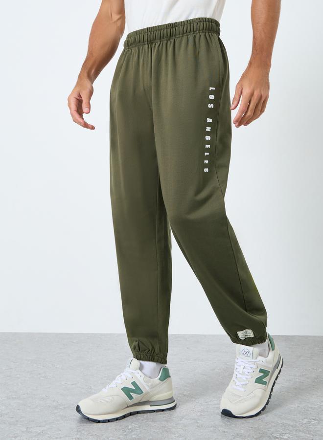 Styli Relaxed Fit Slogan Print Joggers - Image 1