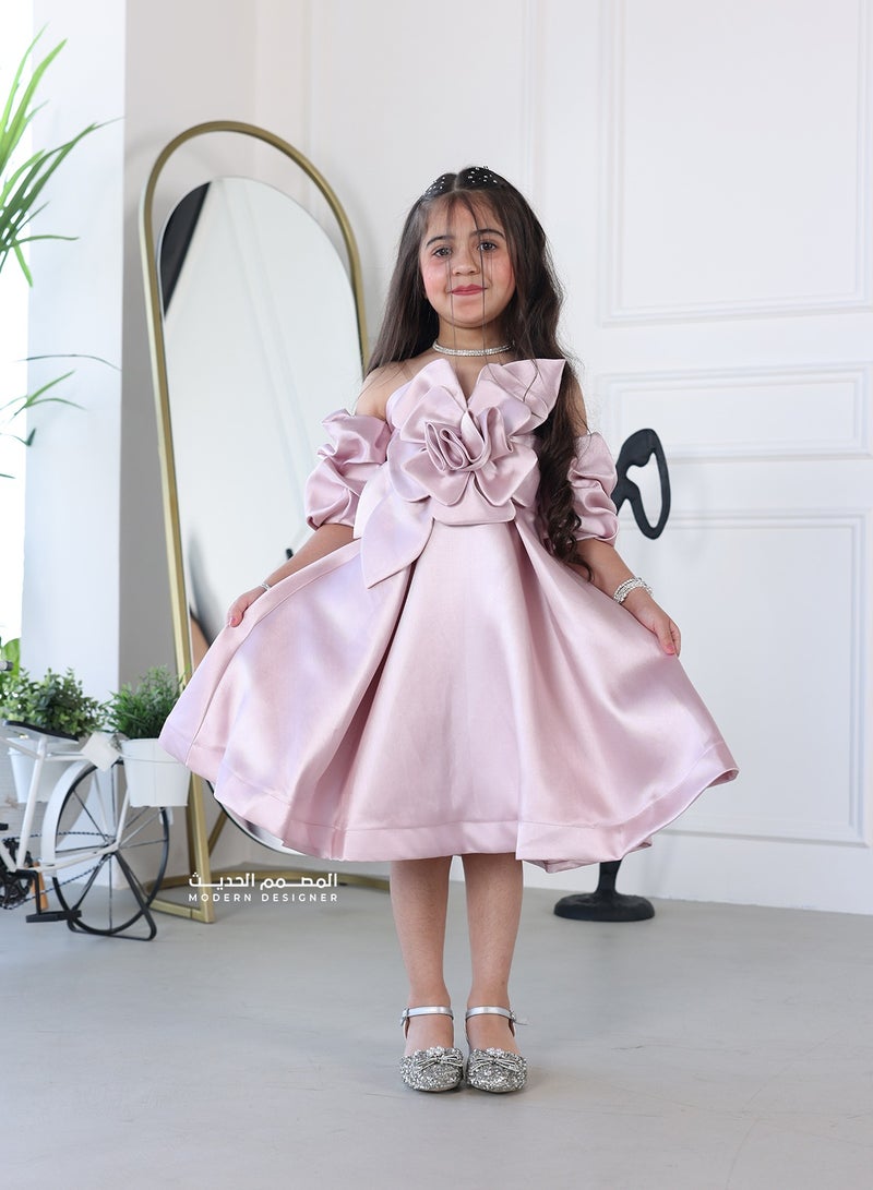 Modern Design A girls' dress with a flower on the chest. The dress features a modern design and a flower on the chest, which makes the dress luxurious, highlighting its beauty and the beauty of the design. It also features unique details and high quality, and helps your child attract attention and feel confident and elegant on any special occasion. - Image 1