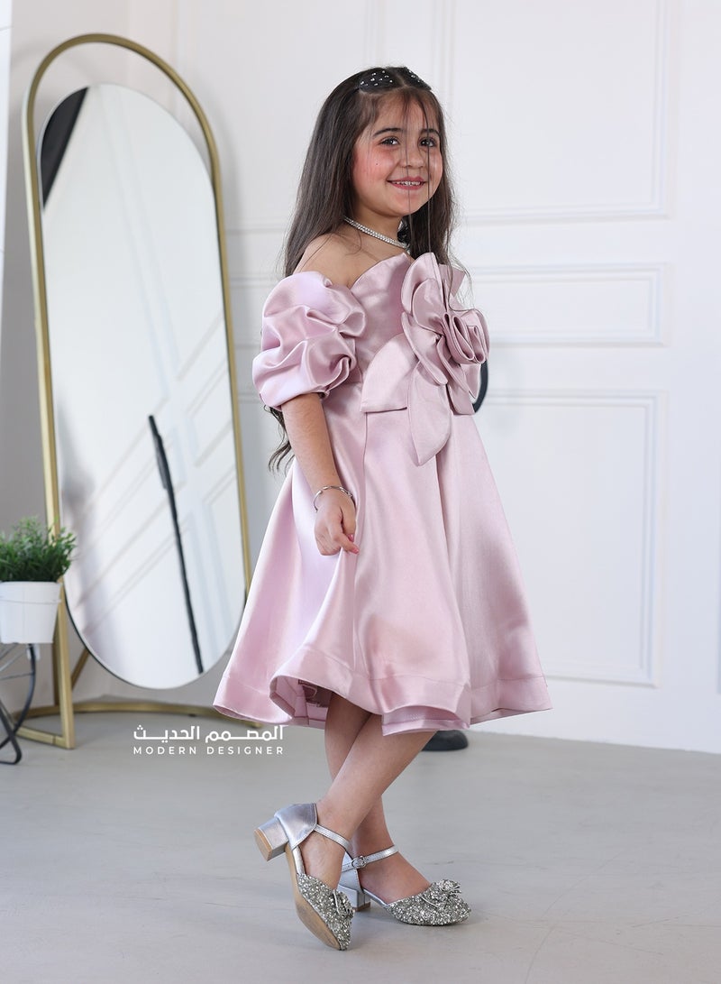 Modern Design A girls' dress with a flower on the chest. The dress features a modern design and a flower on the chest, which makes the dress luxurious, highlighting its beauty and the beauty of the design. It also features unique details and high quality, and helps your child attract attention and feel confident and elegant on any special occasion. - Image 2