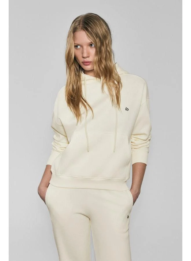Urban Beat  JINGSO Women's Soft Fleece-Lined Hooded Sweatshirt with Kangaroo Pocket and Print Detail in Ecru. for Women | Best Price UAE