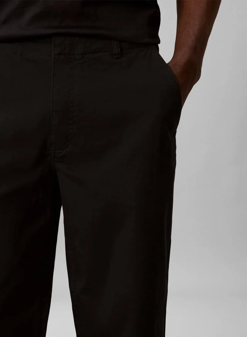 Calvin Klein Jeans Black 90s Loose Cropped Chino Trousers for Men | Best Price UAE