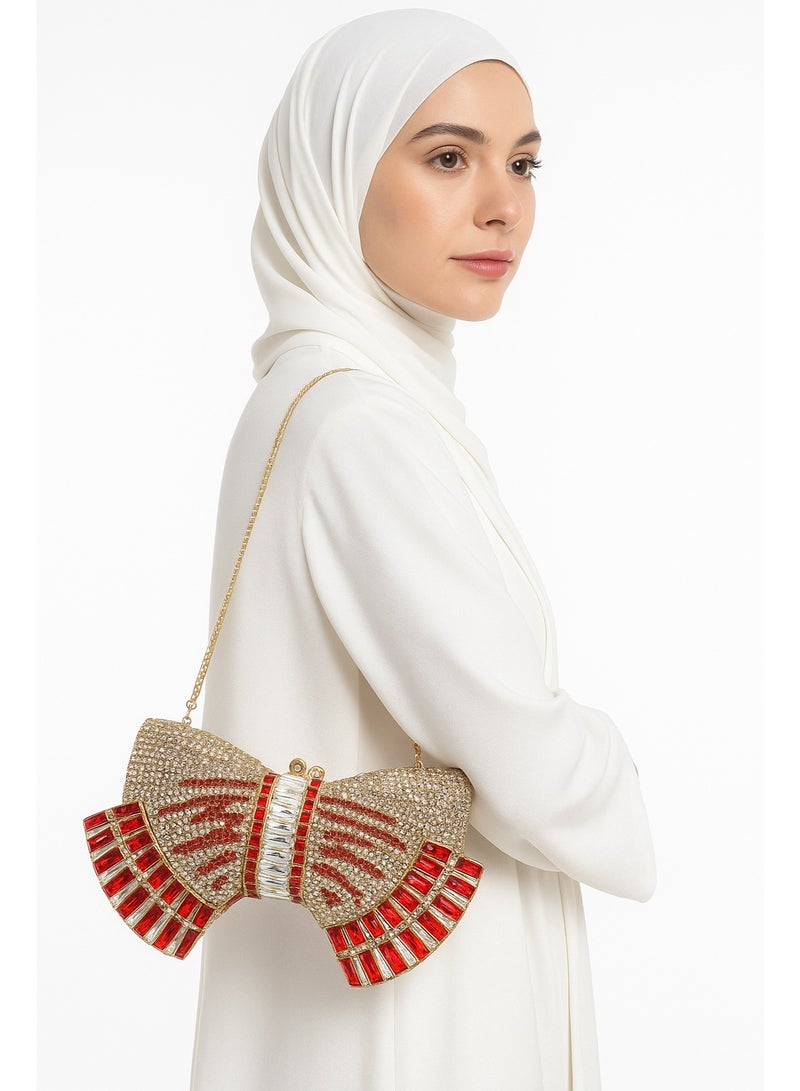 أركاد حقيبة كلاتش نسائية من أركاد للسهرات والحفلات بشكل فيونكة مزينة بالكريستال الأحمر والذهبي مع سلسلة - Image 2