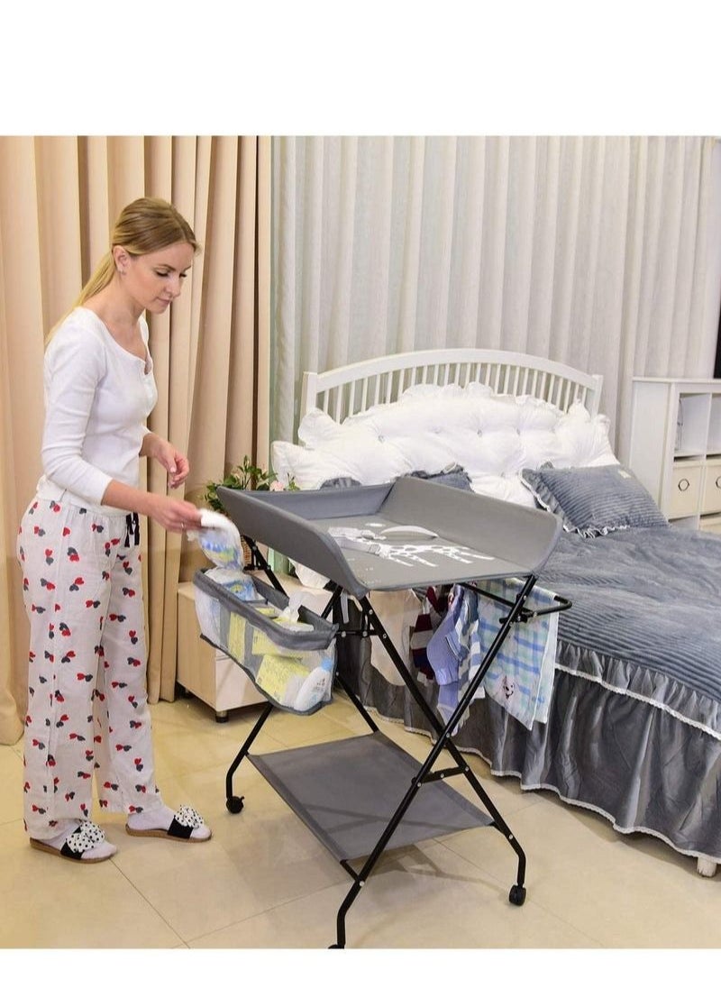 XiuWoo - Portable Baby Changing Table with Wheels and Storage Rack and Bag, Multifunctional Newborn Dressing for Clothes Massage - Image 1