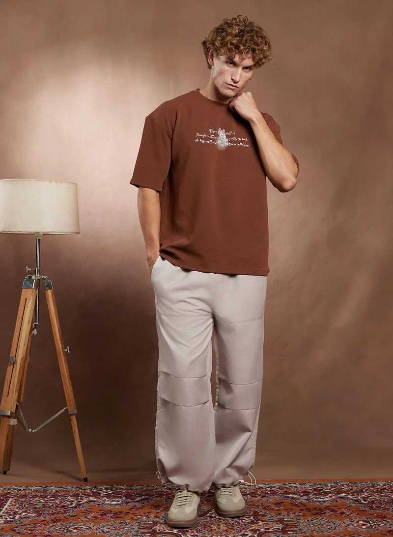 Campus Sutra Campus Sutra Men's Mocha Brown Boxy Mytho-Modernism T-Shirt For Casual Wear | Crew Neck | Short Regular Sleeves | Pull On Closure | T-Shirt Crafted With Comfort Fit For Everyday Wear