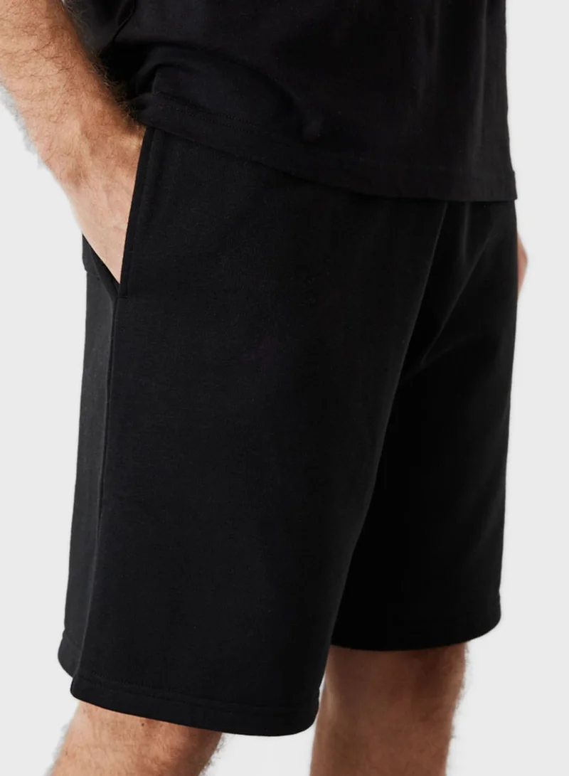 NEW ERA  Essential Logo Shorts for Men | Best Price UAE