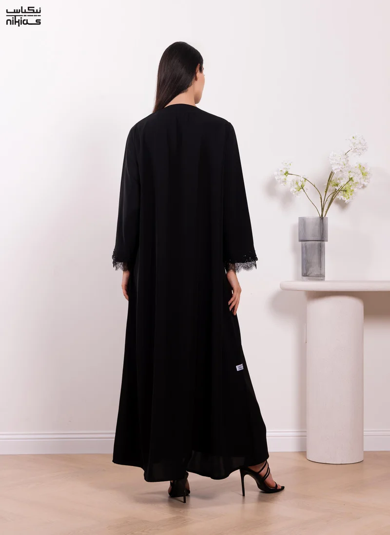 Nikias  Nikias Elegant Cobra Crepe abaya featuring exquisite dantel and handwork for Women | Best Price UAE