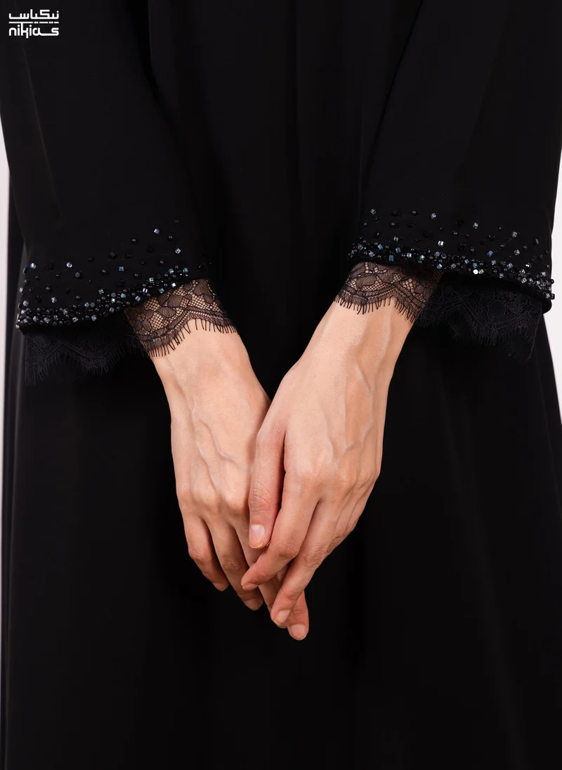 Nikias  Nikias Elegant Cobra Crepe abaya featuring exquisite dantel and handwork for Women | Best Price UAE