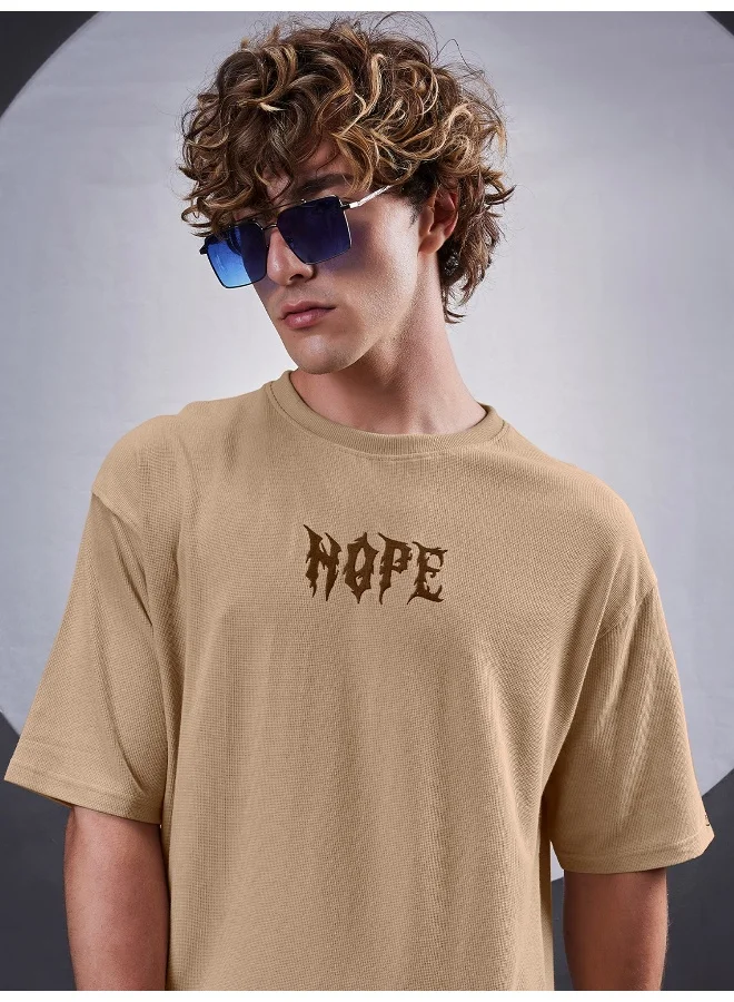 مانياك تيشيرت قطن مانياك رجالي بتطريز "هوب" ورقبة دائرية وأكمام 3/4 بلون بسكويت