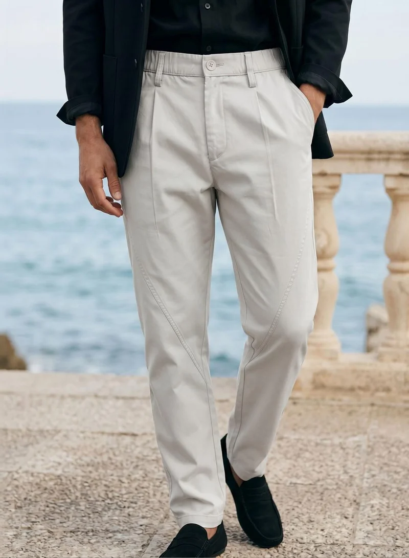 Dennis Lingo  Men Stone Poly Solid Full Chinos Tapered Trouser for Men | Best Price UAE