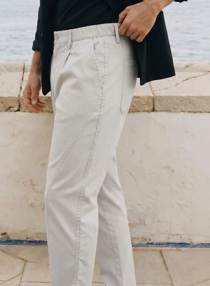 Dennis Lingo  Men Stone Poly Solid Full Chinos Tapered Trouser for Men | Best Price UAE
