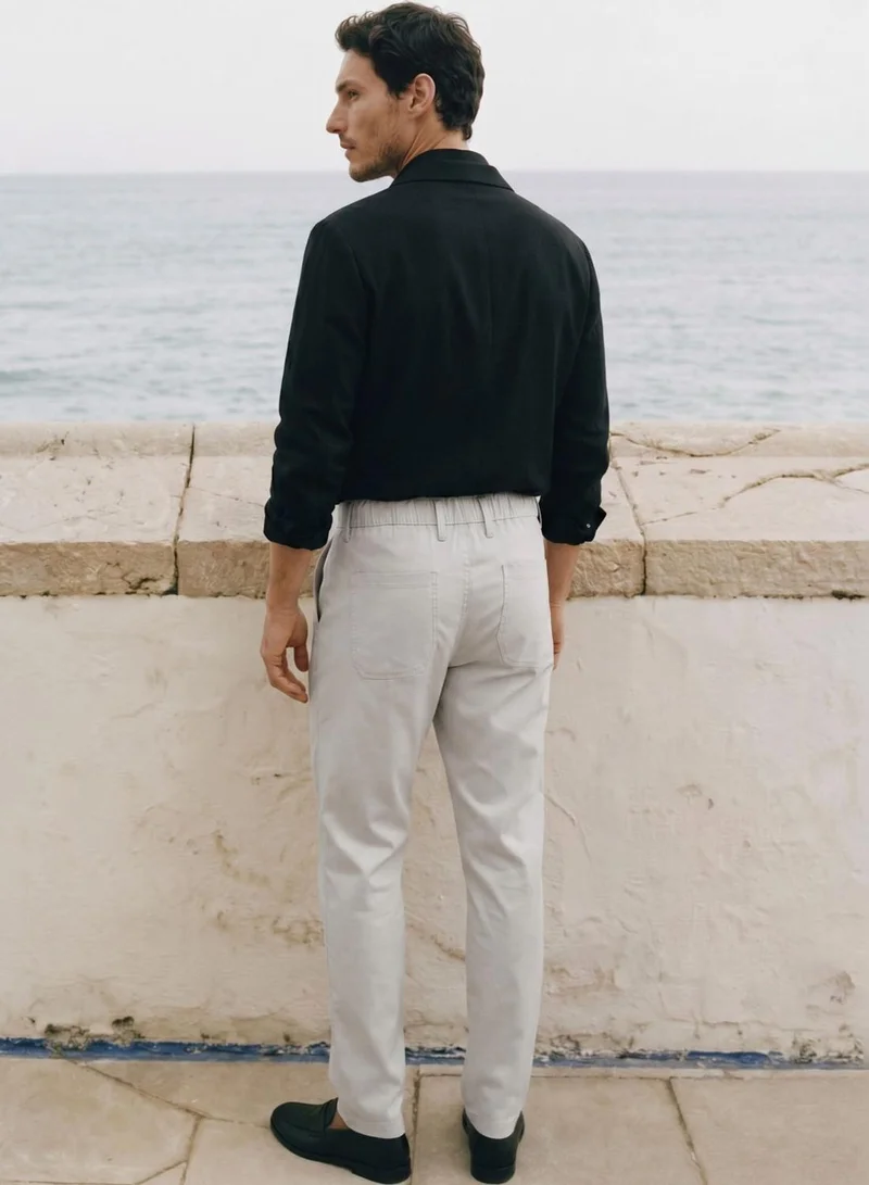 Dennis Lingo  Men Stone Poly Solid Full Chinos Tapered Trouser for Men | Best Price UAE