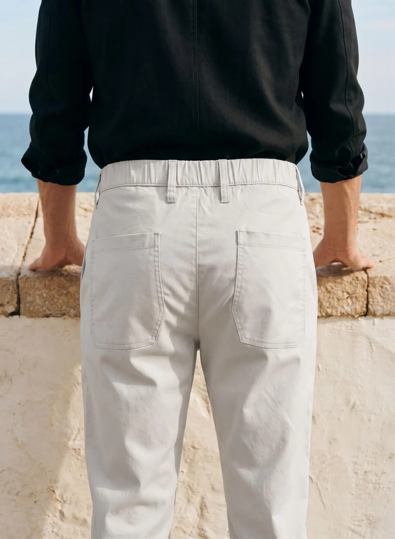 Dennis Lingo  Men Stone Poly Solid Full Chinos Tapered Trouser for Men | Best Price UAE
