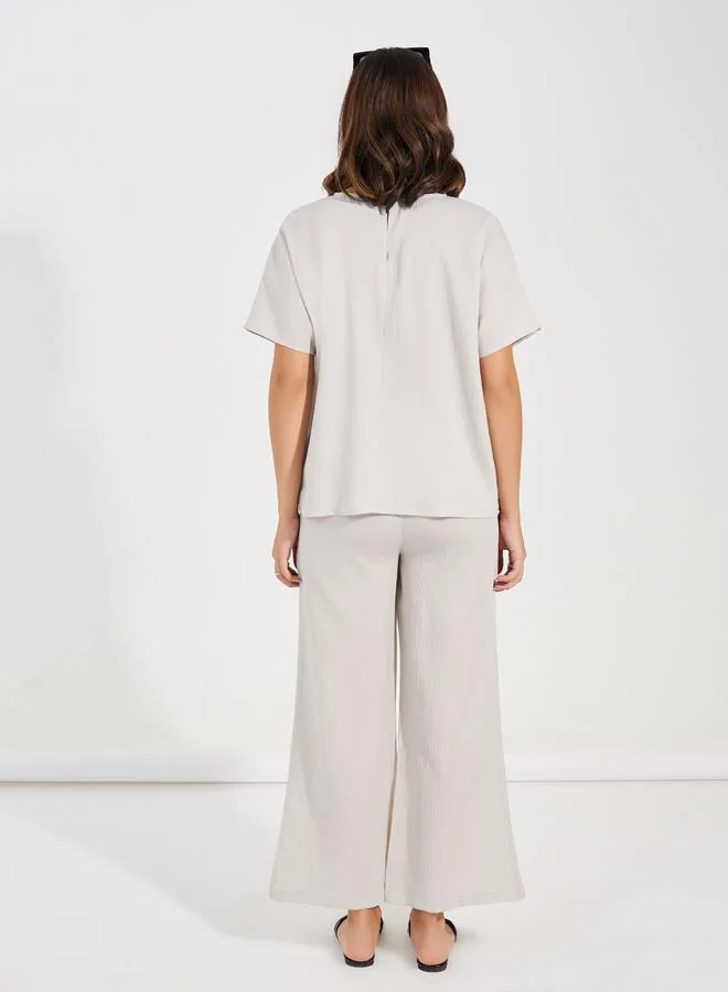 Styli Textured Round Neck Top & Wide Leg Pants Co-Ords