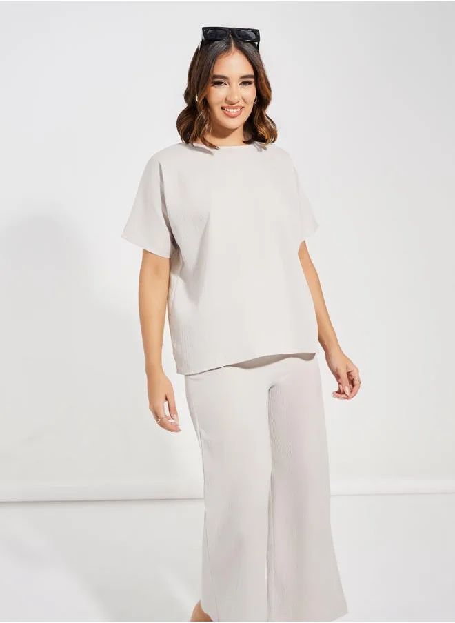 Styli Textured Round Neck Top & Wide Leg Pants Co-Ords