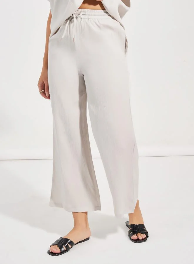 Styli Textured Round Neck Top & Wide Leg Pants Co-Ords