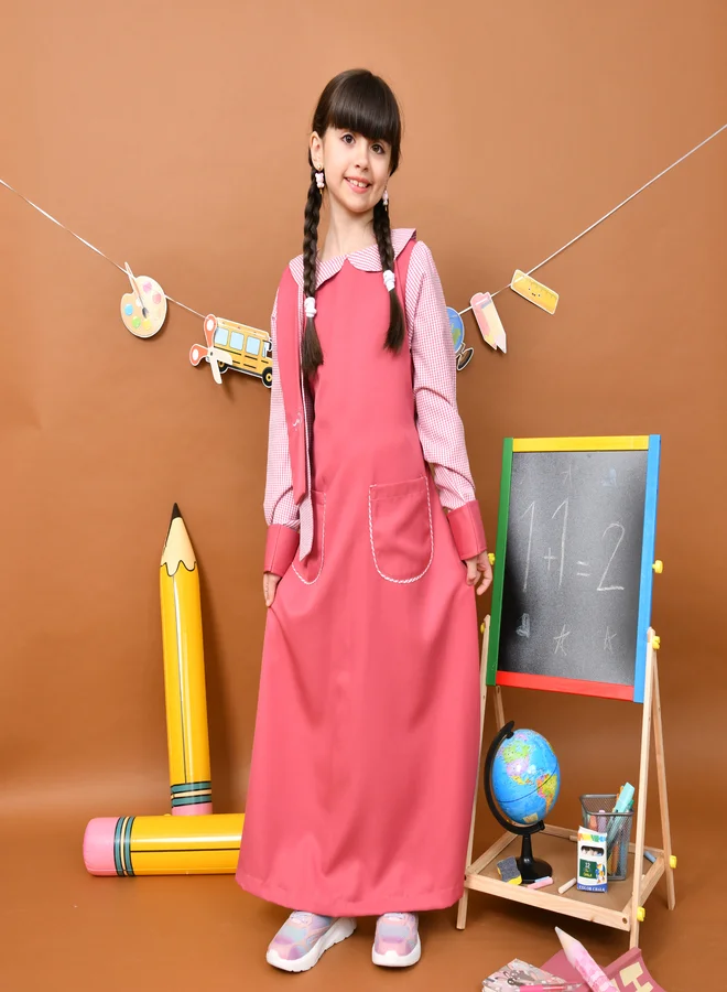 HAWRAA ABAYA Lorena Pink Apron: Stylish with a side sash for name embroidery, checkered sleeves and collar with front pockets.
