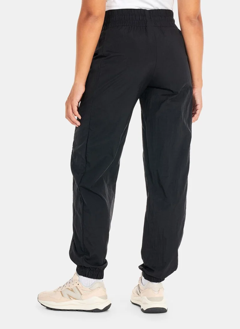New Balance Women's Athletics Amplified Woven Pants