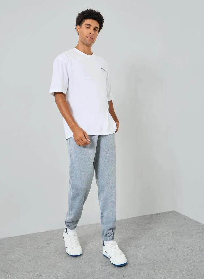 Styli Men White Graphic Print Oversized T-Shirt
