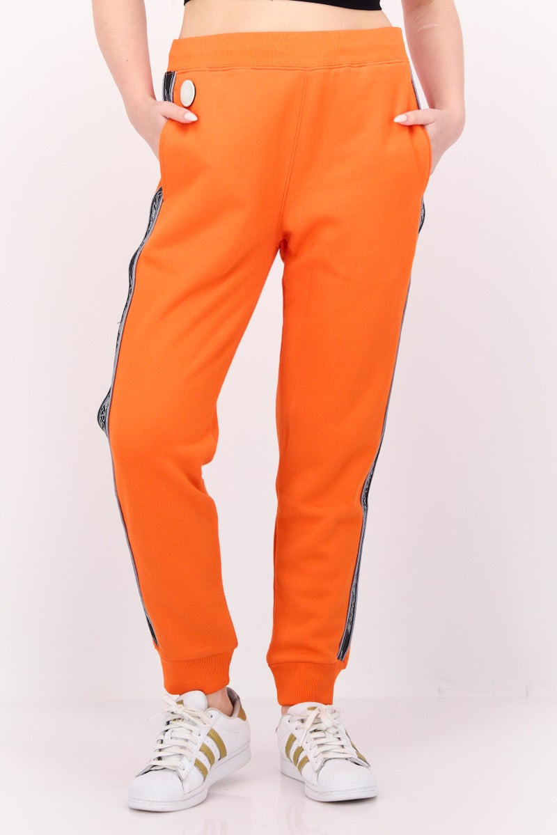 Aape BY *A BATHING APE® Women Regular Fit Brand Logo Jogger Pants, Orange - Image 1